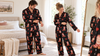 Couple checking the fit of matching personalized pajama sets