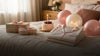 Natural birthday morning pajama scene with cake gifts and balloons for birthday pajama ideas