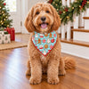 Dog wearing a matching bandana in the aqua cocoa mug and cookie Christmas print