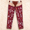 Personalized football sports pajama pants flat lay with name, number, players and flaming footballs
