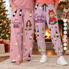 Two women by a Christmas fireplace in matching personalized wine pants, lounge and sweatpants styles with their own quotes, cartoon portraits and names