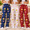 Three friends in navy, white and red personalized softball pajama pants holding mugs together