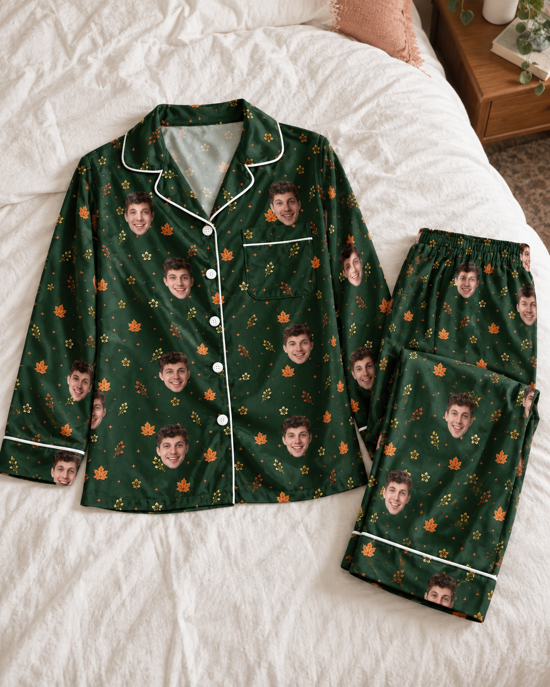 Dark green personalized face pajama set arranged naturally on a warm white bed